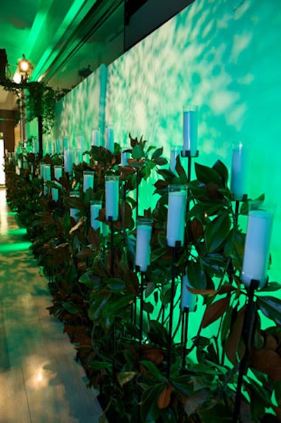 A row of candlesticks lined a hallway. Due to the store's restrictions and the large number of guests in attendance, Louis Vuitton was not permitted to light these.