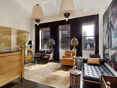 At approximately 357 square feet, the living room is the largest area in the venue and is partially furnished with artwork.