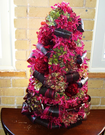 Floral trees from Unforeseen Events can be created with burgundy orchids, peonies, and hydrangeas or fruit and berries.
