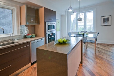 Signs posted throughout the home highlighted green building features like reclaimed hardwood flooring and quartz countertops.