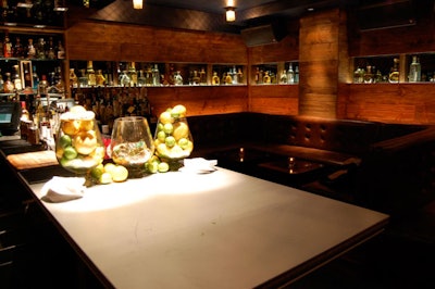 At Double A, mixologists prepare sophisticated cocktails at a central drink station.