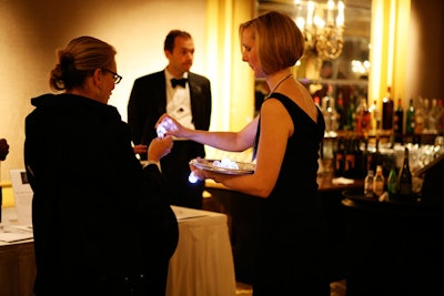 Guests who purchased $100 raffle tickets got blinking plastic rings; one of them won a kunzite and diamond ring valued at $9,800, which A. Marek Fine Jewelry donated to the event.