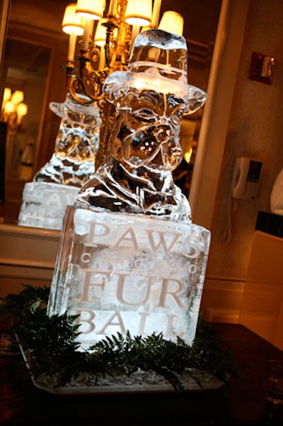 An ice sculpture depicted a dog in a top hat; the same image appeared on the event's invite and signage.
