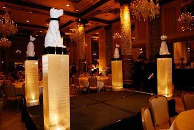 In the Gold Coast ballroom, a live auction took place on a stage that Kehoe surrounded with illuminated dog-topped pillars.