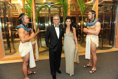 Models dressed in Egyptian-inspired garb fanned guests with palm leaves at the entrance to the gala.