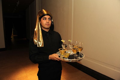 Servers from The Butler Did It wore gold headdresses and passed cocktails such as Golden Grape Martinis to guests during the gala.