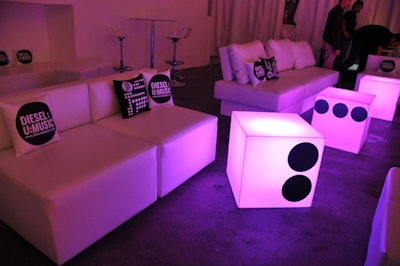 Room Service Furniture and Event Rentals provided the white leather sofas, ottomans, and glowing cube tables in the second-floor V.I.P. area.