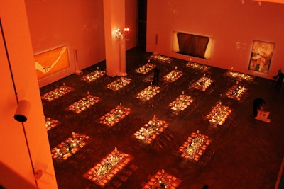 Transparent tables and chairs and orange lighting designed by Bentley Meeker decked the dinner for 240 guests in MoMA's atrium.