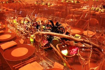 Floral arrangements designed by Ovando stretched across each of the tables.