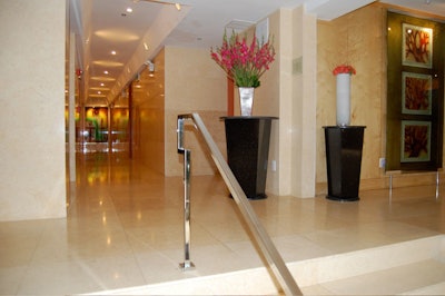 The lobby, like much of the hotel, has marble walls and floors.