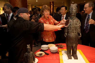 The Food Network's Ace of Cakes baker Duff Goldman and National Geographic Museum director Susan Norton cut the terra cotta warrior cake Duff created.