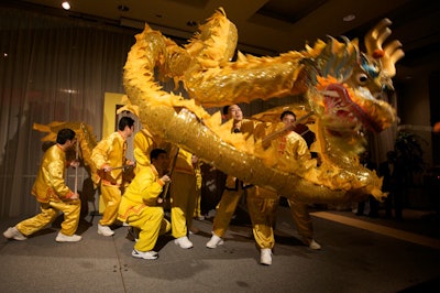 Rita Dooley visited Asian festivals in the area over the past year, where she met local Chinese musicians and dancers and asked them to perform during the opening gala. The Asian Community Service Center in Vienna, Virginia, supplied the evening's 10-person Chinese dragon performers.