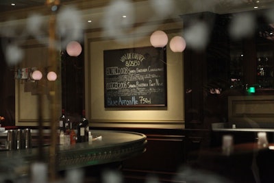 A chalkboard wine menu underscores the venue's French feel.