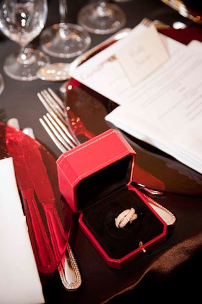 Jewelry placed in red boxes topped tables for the dinner party held inside Cartier's Bloor Street store.