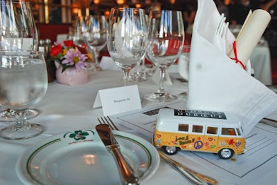 Mini Volkswagen Love Buses branded with the Georges Duboeuf logo sat at each place setting as a takeaway for guests.
