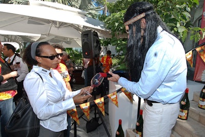 Georges Duboeuf winemaker Stéphane Queralt wore a long black hippie wig and served the first glasses of the Beaujolais Nouveau 2009.