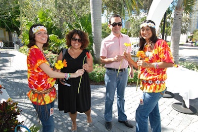 Hippies from the Michael Alan Group handed out flowers to guests upon arrival at the luncheon.