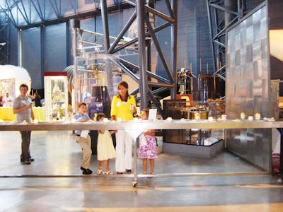 Guests grabbed miniature apple pies and strawberry shortcakes by Occasions Caterers from a conveyor belt after a screening of Transformers: Revenge of the Fallen at the National Air and Space Museum in Washington.