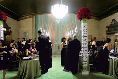 The American Cancer Society's Discovery Ball in Chicago had a paperless check-in area with tall, bouquet-topped columns directing guests to alphabetically organized stations.