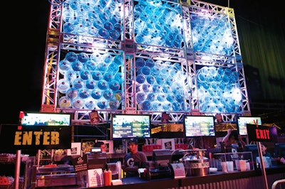 For the opening-night party of the Miami run of Fuerza Bruta, 500 five-gallon water jugs were grouped into wall installations behind a bar, where they divided the lounge from the performance area.