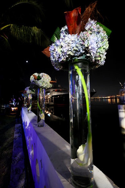 Blooming Design and Events decorated the Ridingers ' gardens with arrangements of white calla lilies and blue hydrangeas.