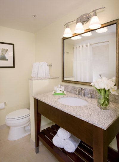 Guest bathrooms will feature marble counter tops and espresso wood furnishings.