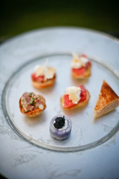 Jewell Events Catering's passed hors d'oeuvres included tuna tartare, seared beef crostini with truffle cream, baby purple potatoes with creme fraîche and caviar, and mini crab quiche.