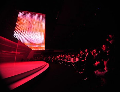 A light installation descended from the ceiling to signal the beginning of the A8's world premiere presentation.