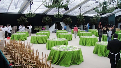 Multiple vendors worked together to ready the clear-topped dinner tent, which housed 34 round tables of 10.