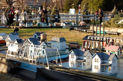 Each year, volunteers from local train clubs construct and maintain miniature railroad displays, which encircle the base of the tree.