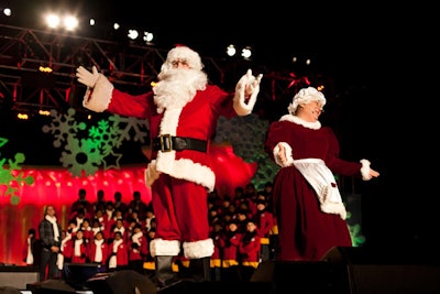 Entertainers dressed as Santa and Mrs. Claus performed between musical acts.