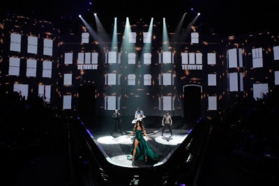 Following recent acts such as the Spice Girls and Usher, the Black Eyed Peas were tapped as the night's sole musical guest, performing in the center of the giant V-shaped runway.