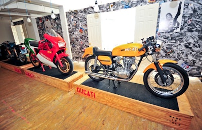 The second floor of Duncan Quinn's temporary store houses a dining room used for its nightly private parties and wine tastings, a fitting room where guests could be measured for bespoke suits, and three Ducati motorcycles.