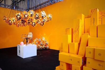 Veuve Clicquot used its own champagne boxes to create the lighting fixtures on display in its exhibition area adjacent to the Audi lounge.