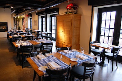 Blue and white runners top tables fashioned out of old floorboards.