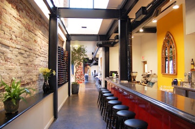 A long bar sits inside the entrance to the restaurant, in a converted brick house in the city's east end.