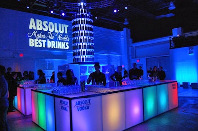At the bar, hundreds of Absolut bottles formed a bottle-shaped sculpture.