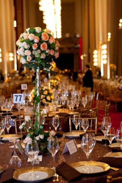 The evening's color scheme included soft pinks and rich browns, with tablecloths covered in copper sequins.
