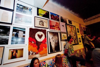 Framed art and photographs covered the walls of the pop-up Max Fish, similar to the real bar's decor in New York's Lower East Side neighborhood.