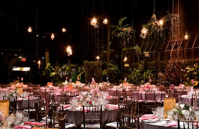 Planners brought in additional foliage to enhance the existing peripheral decor once the dining tables were cleared for the more heavily populated dessert reception.