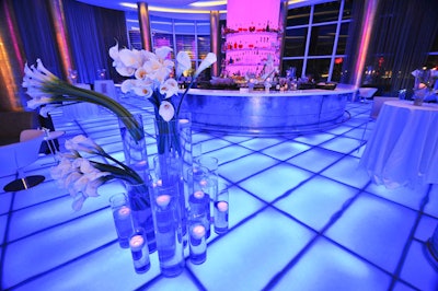 The largest floral arrangement in the Fontainebleau's lobby bar incorporated 11 cylindrical vases filled with water, calla lilies, and floating faux-candles.