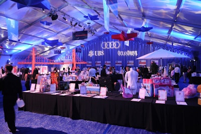 During dinner, Best Buddies staffers and volunteers cleared the silent auction items from the cocktail reception tent to make room for the Chris Brown concert, which took place at the end of the night.