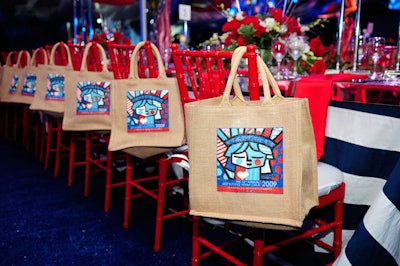A Romero Britto painting of the Statue of Liberty adorned the gift bags on each of the chairs in the dinner tent.