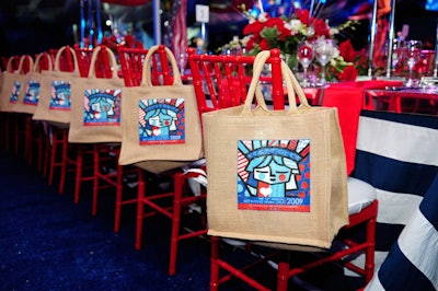 A Romero Britto painting of the Statue of Liberty adorned the gift bags on each of the chairs in the dinner tent.