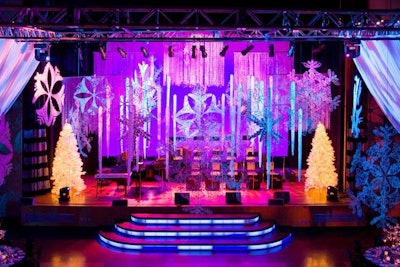 Oversize snowflakes hung from the ceiling and two white Christmas trees flanked either side of the stage in the Carlu's concert hall.