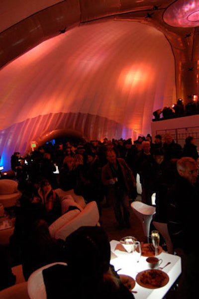 One of two dome structures alongside the main tent remained open for the party; another was closed as a wind contingency.