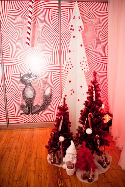 White garden gnomes and red tinsel trees sat throughout the candy room, where red and white op art posters covered the walls.
