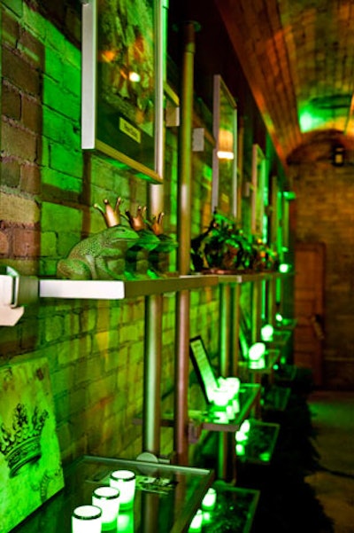 Frogs, crowns, and framed photos depicting characters from 'Puss in Boots' and 'The Frog Prince' lined a series of shelves in the bar area.