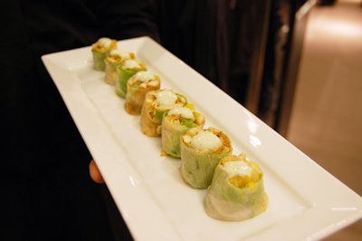 Servers passed hors d'oeuvres from North 44 to guests during a cocktail reception held on the first and second floors of the store.