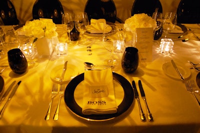 Name cards and logoed Hugo Boss napkins marked each place setting.